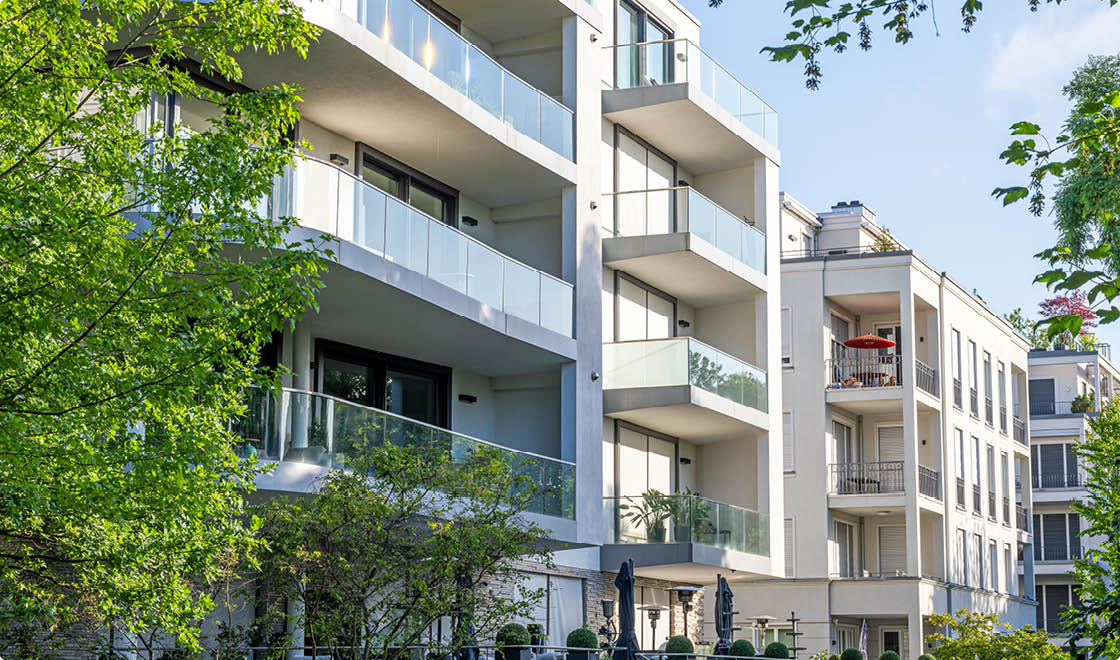 Modern apartment buildings surrounded by greens seen in Berlin, Germany